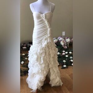 Vera Wang wedding dress. Never been used but altered. 5’3 ht, 34c, 26” waist